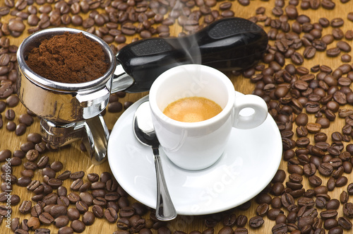 An espresso machine group head with fresh ground coffee