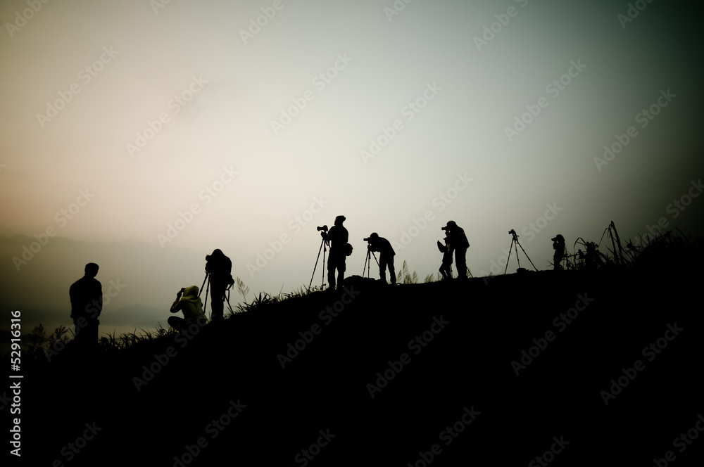 Silhouette of photography on the cliff. Phu Chee Fah Thailand.