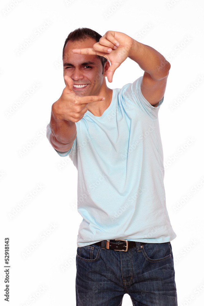 Charming young man making a frame with his hands Charming young man making a frame with his hands
