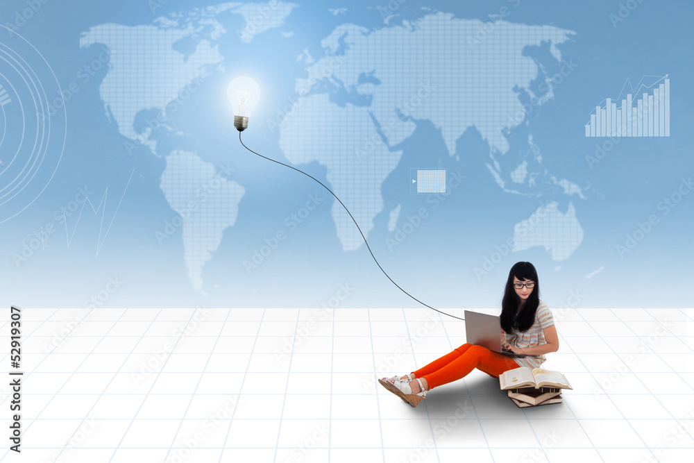 Asian student using laptop on world map background Asian student using laptop on world map background