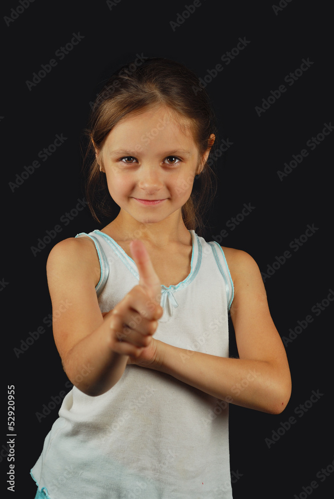 Portrait of a beautiful girl showing thumbs up