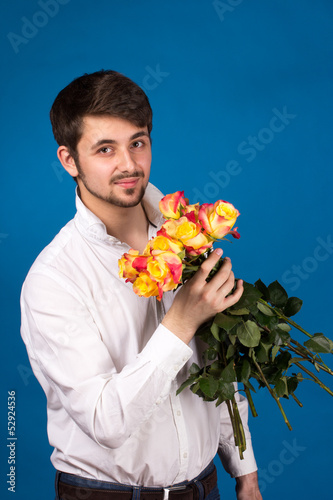 Man with bouquet of red roses