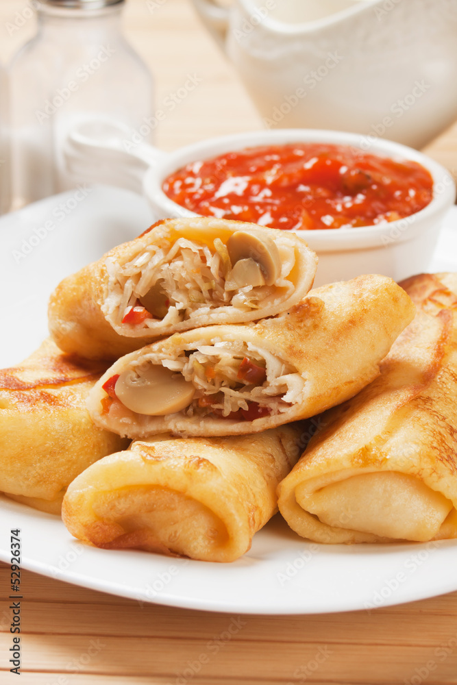 Egg rolls with tomato sauce