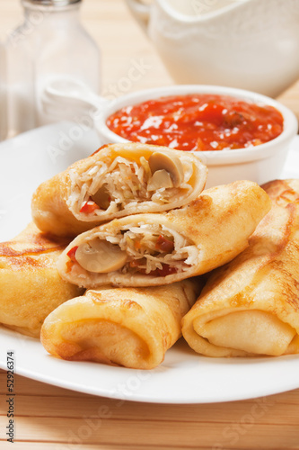 Egg rolls with tomato sauce