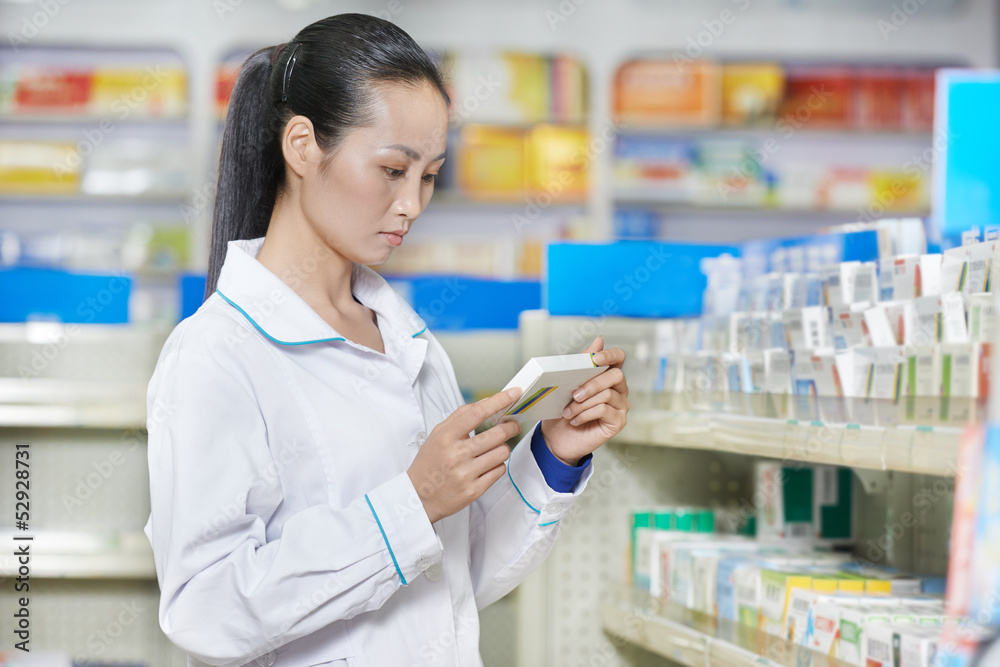 Chinese pharmacy chemist woman in china drugstore