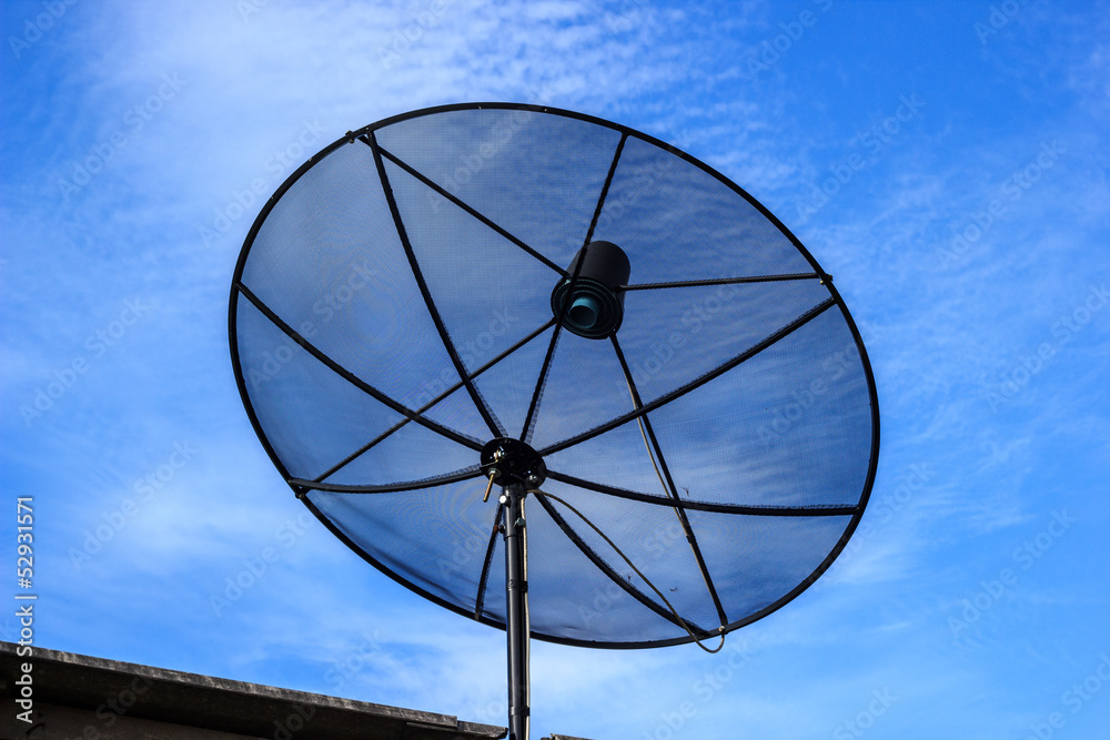 Satellite dish in blue sky