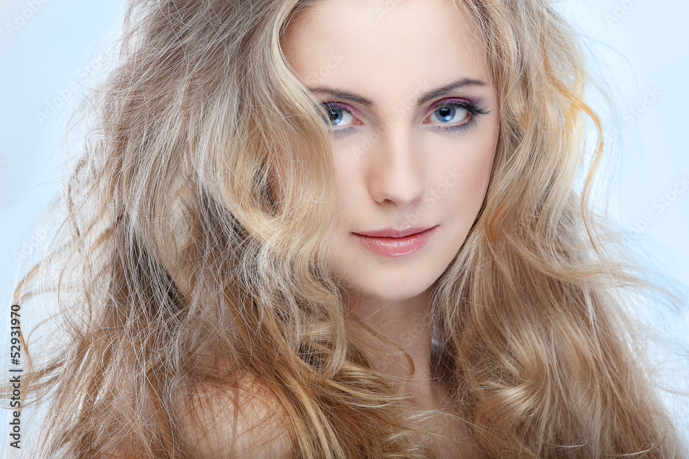whiteheaded young woman with beautiful blue eyes on blue whiteheaded young woman with beautiful blue eyes on blue
