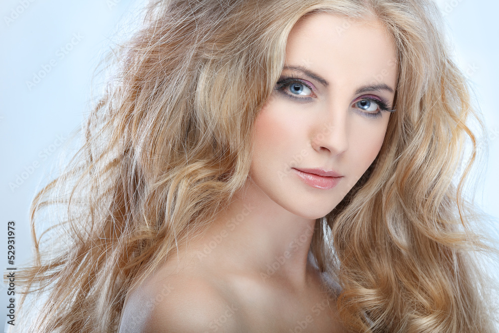 whiteheaded young woman with beautiful blue eyes on blue whiteheaded young woman with beautiful blue eyes on blue