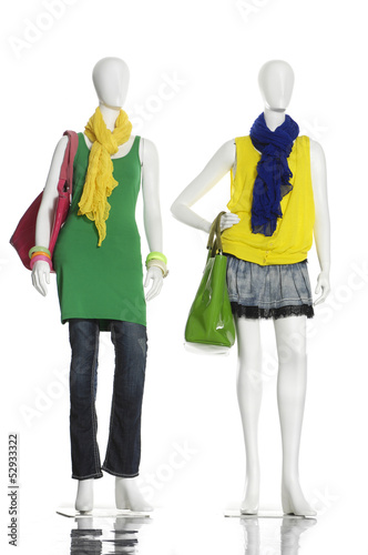 full-length female clothes in scarf with bag on a mannequin