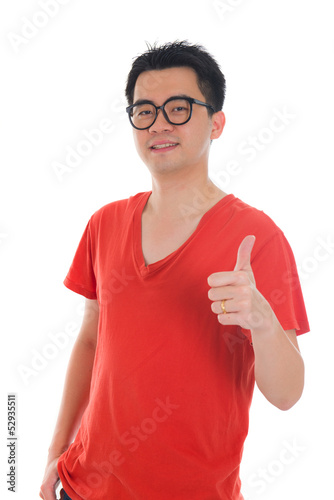 young asian man with a big smile and thumbs up sign