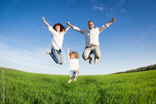 Happy family jumping