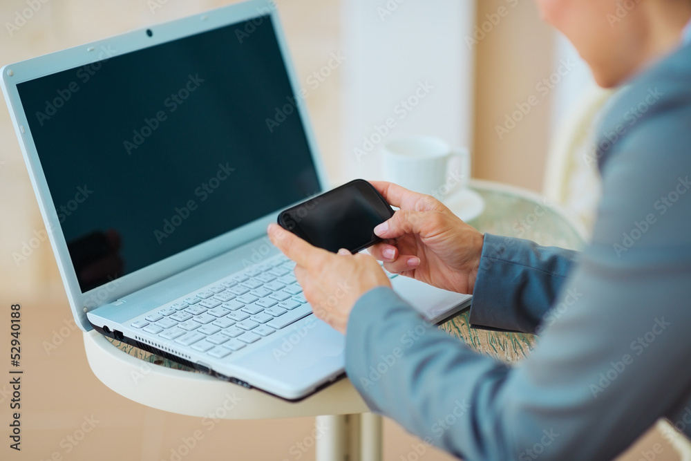Closeup on business woman writing sms on terrace. rear view Closeup on business woman writing sms on terrace. rear view