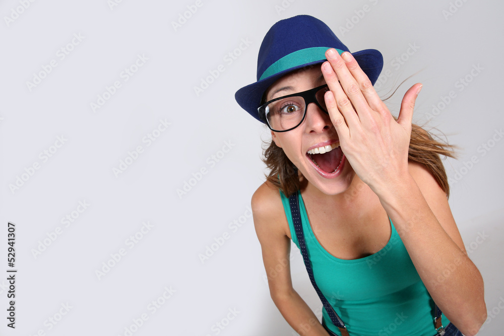 Cheerful girl covering one eye Cheerful girl covering one eye
