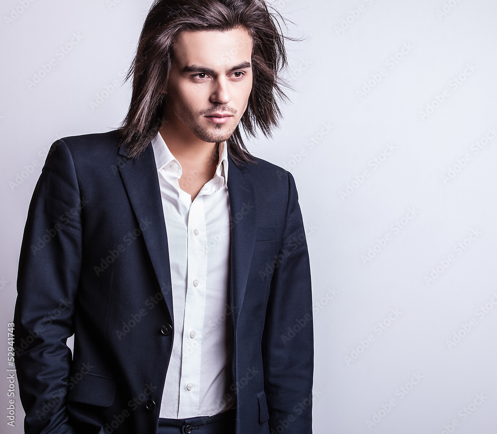 Portrait of handsome long-haired stylish man. Portrait of handsome long-haired stylish man.