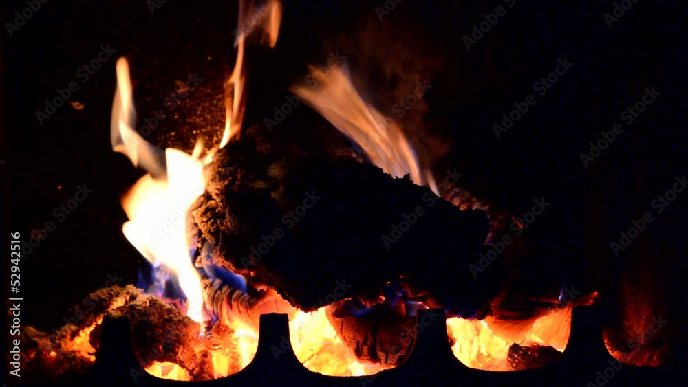 Closeup HD footage with burning log in fireplace.