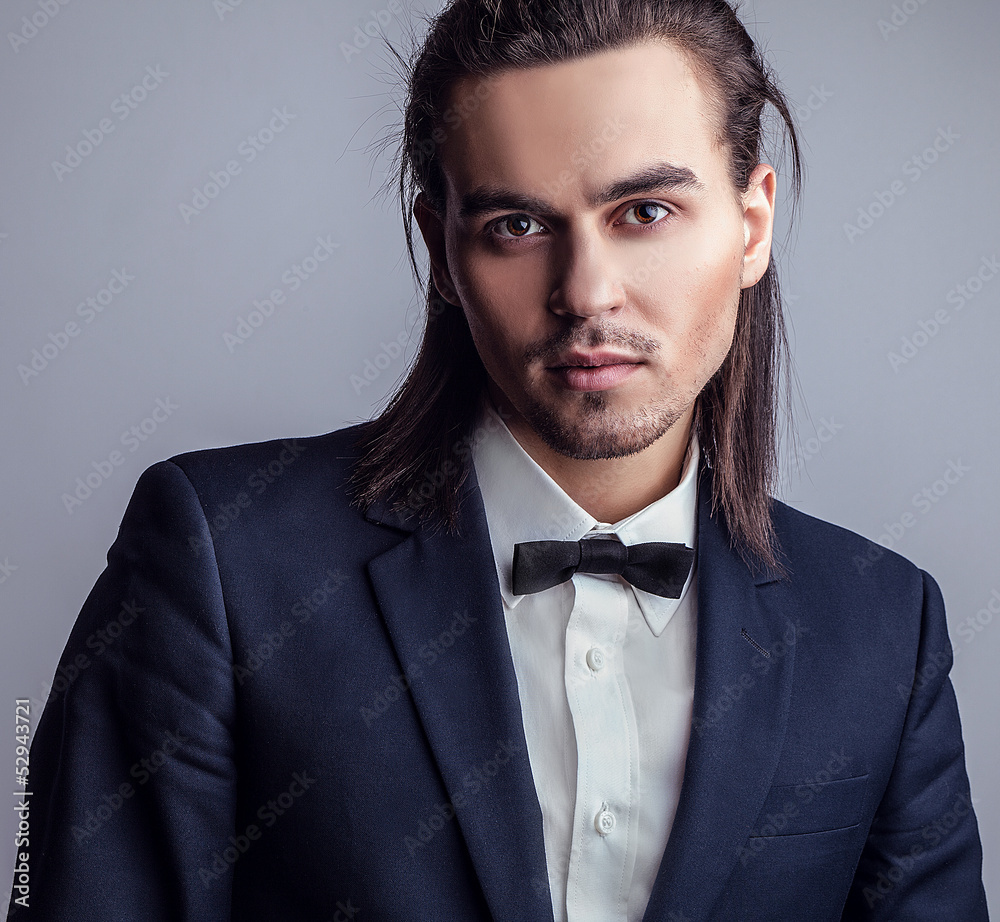 Portrait of handsome long-haired stylish man. Portrait of handsome long-haired stylish man.