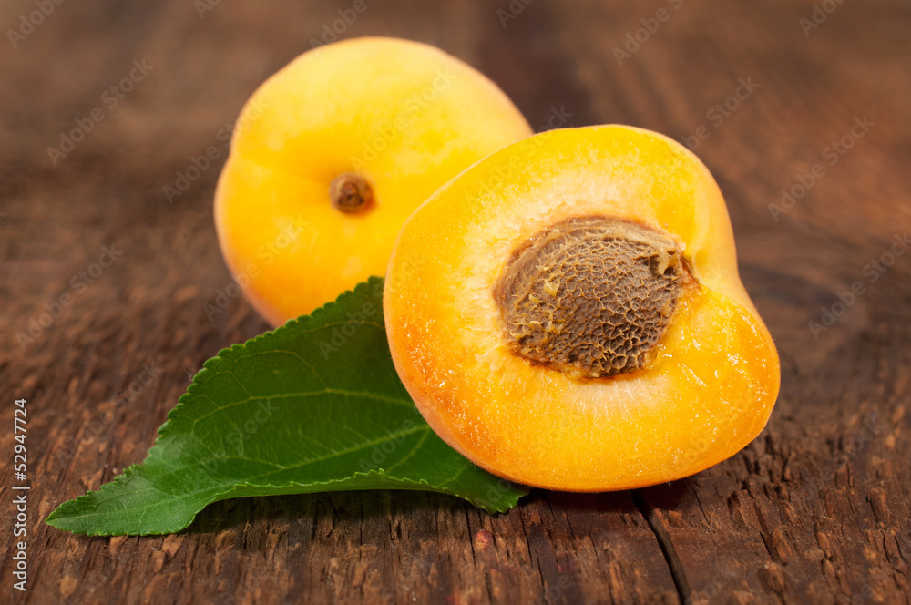 ripe apricots on wooden background