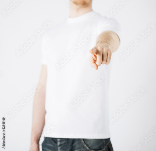 man pointing his finger at you