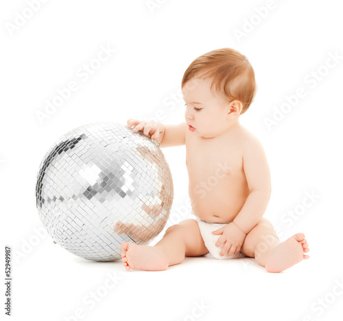 child playing with disco ball
