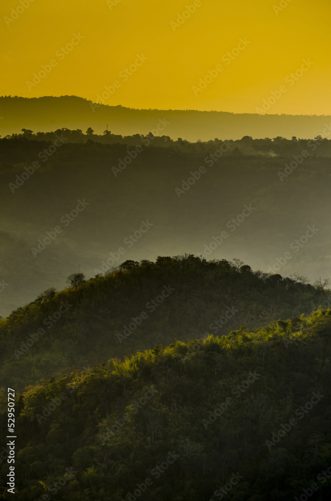 Mountain range in the rays of the rising sun