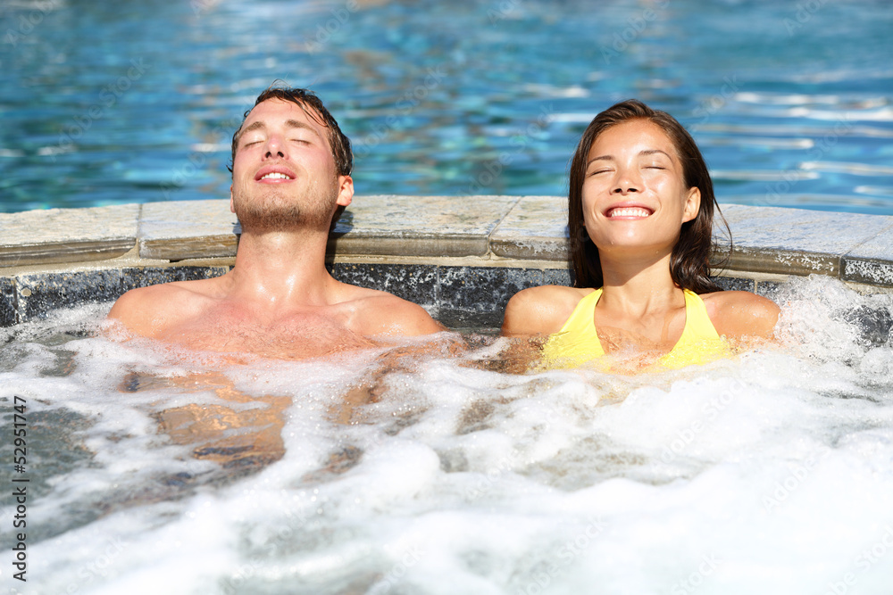 Spa couple relaxing enjoying jacuzzi hot tub