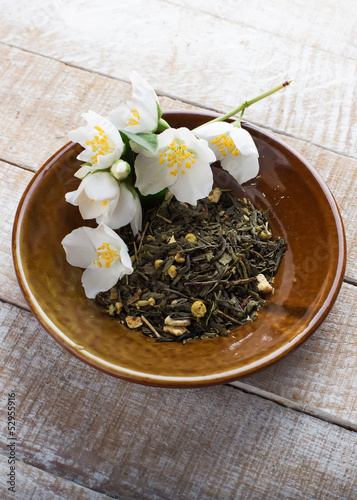 Dry herbal tea on plate photo