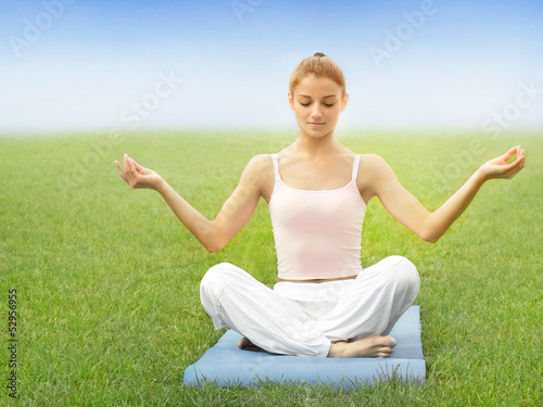Beautiful Woman doing Yoga exercises