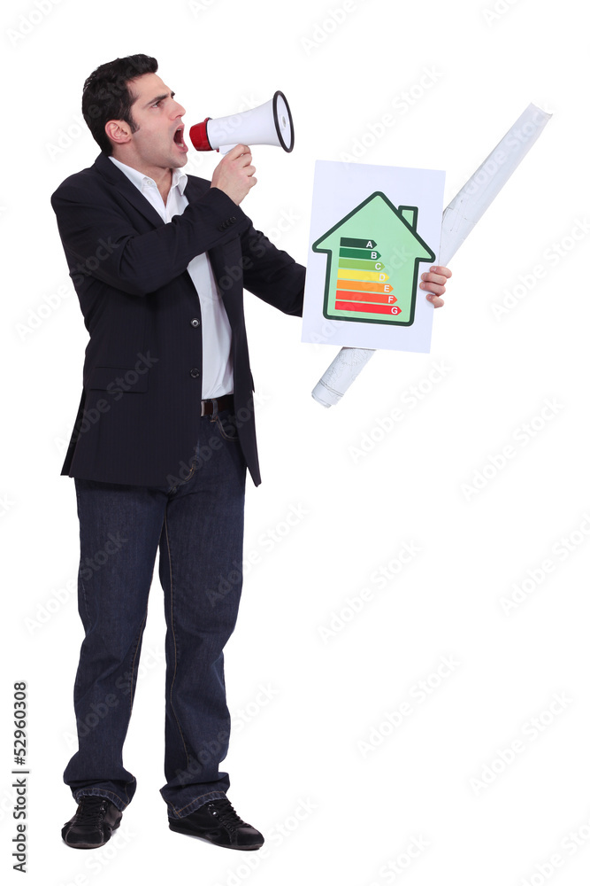 Businessman with a loudspeaker and energy rating card Businessman with a loudspeaker and energy rating card