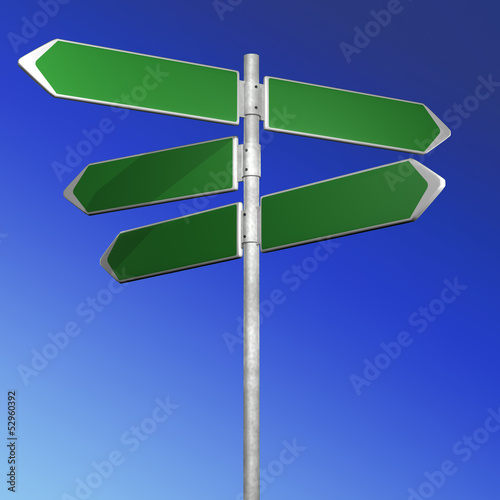 green directionl signs on a blue background