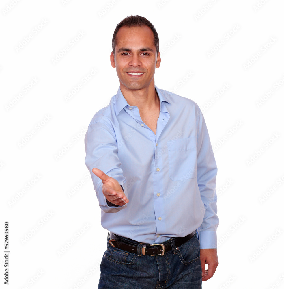 Charming adult man extending handshake at you