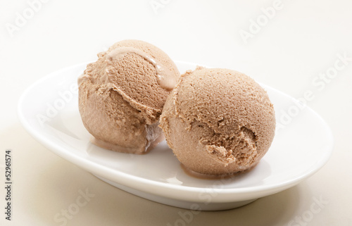 ice cream scoops on white plate close-up
