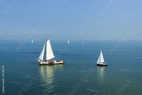 Seascape with big and small sailboats