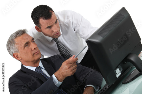 duo of businessmen with computer photo