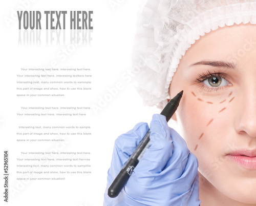 Beautician draw correction lines on woman face