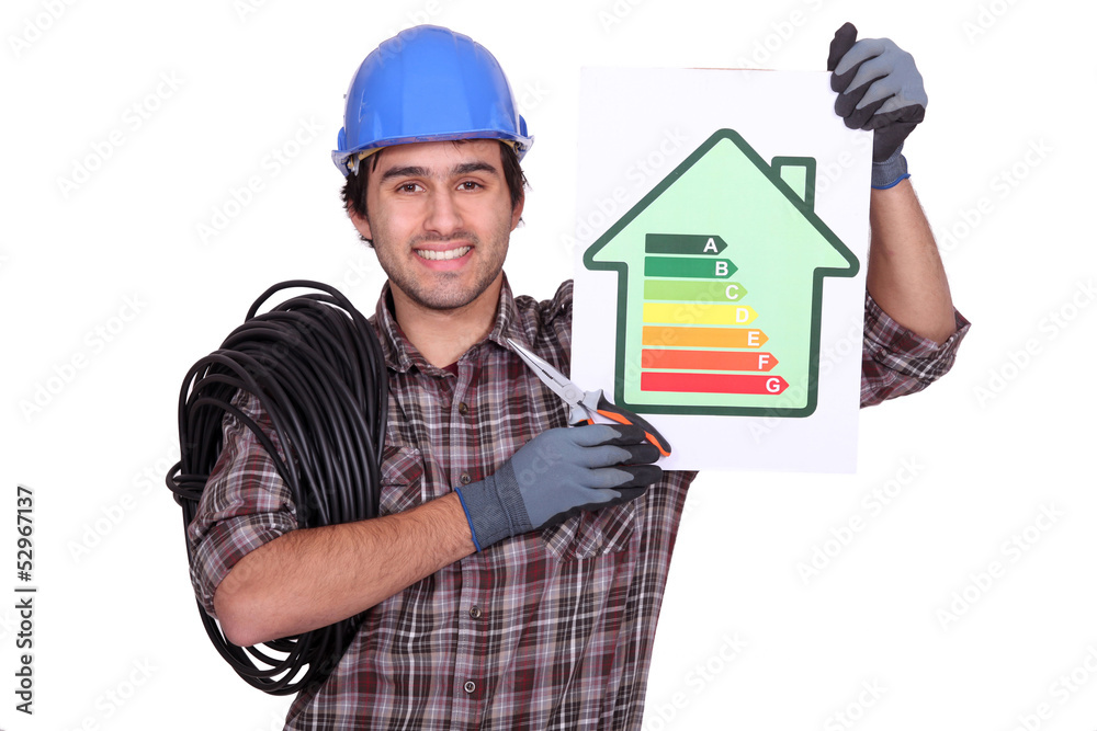electrician holding an energy consumption label electrician holding an energy consumption label