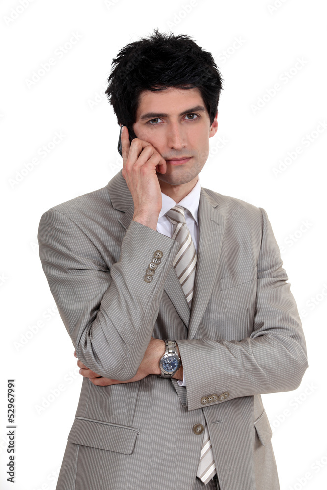 handsome businessman on the phone handsome businessman on the phone