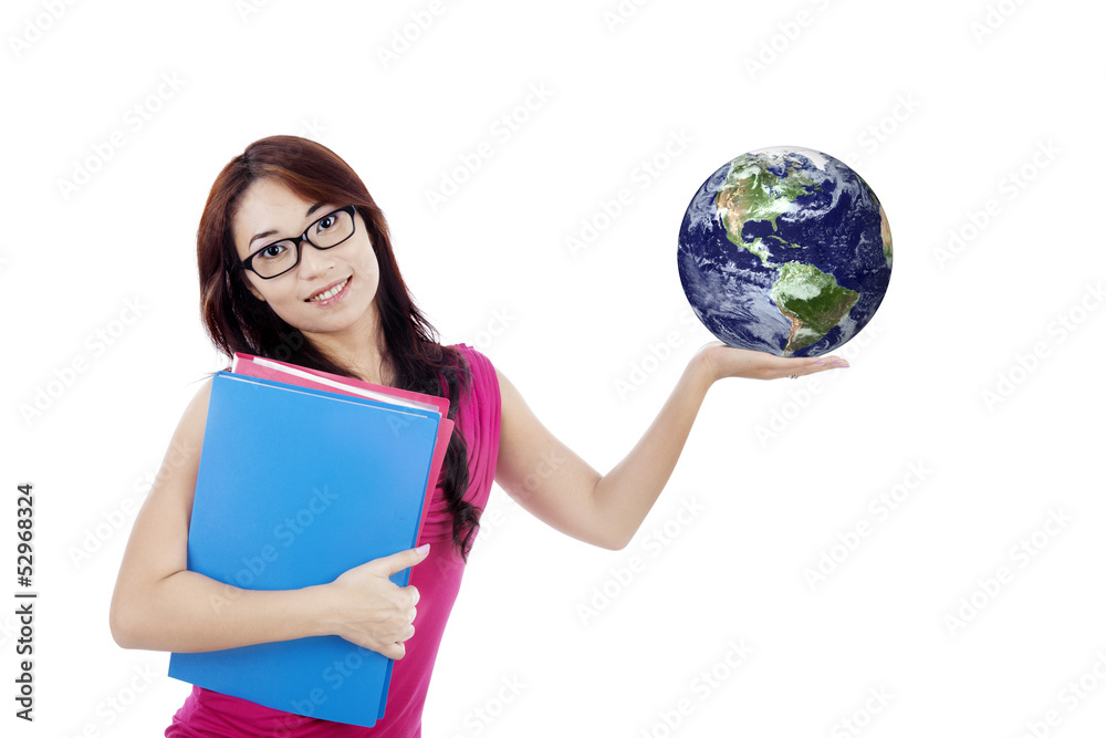 Fototapeta premium Beautiful female student holds globe isolated on white