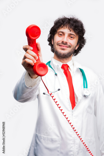 doctor showing a classic telephone reciver photo