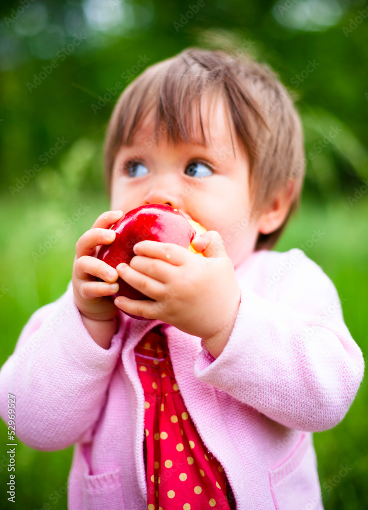 little girl eats an apple little girl eats an apple