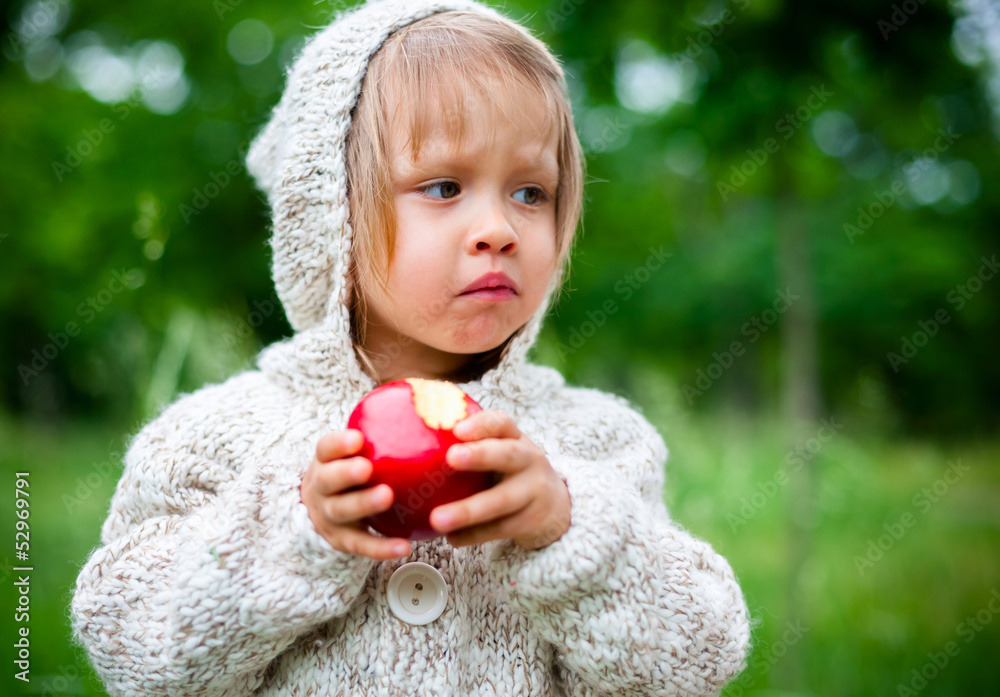 little girl eats an apple little girl eats an apple