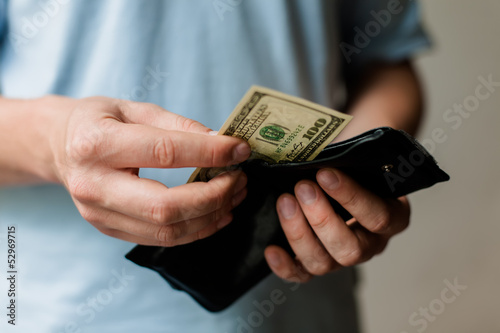 Man gets money from the wallet