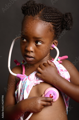 Photography African Girl holding a stethoscope  to her heart
