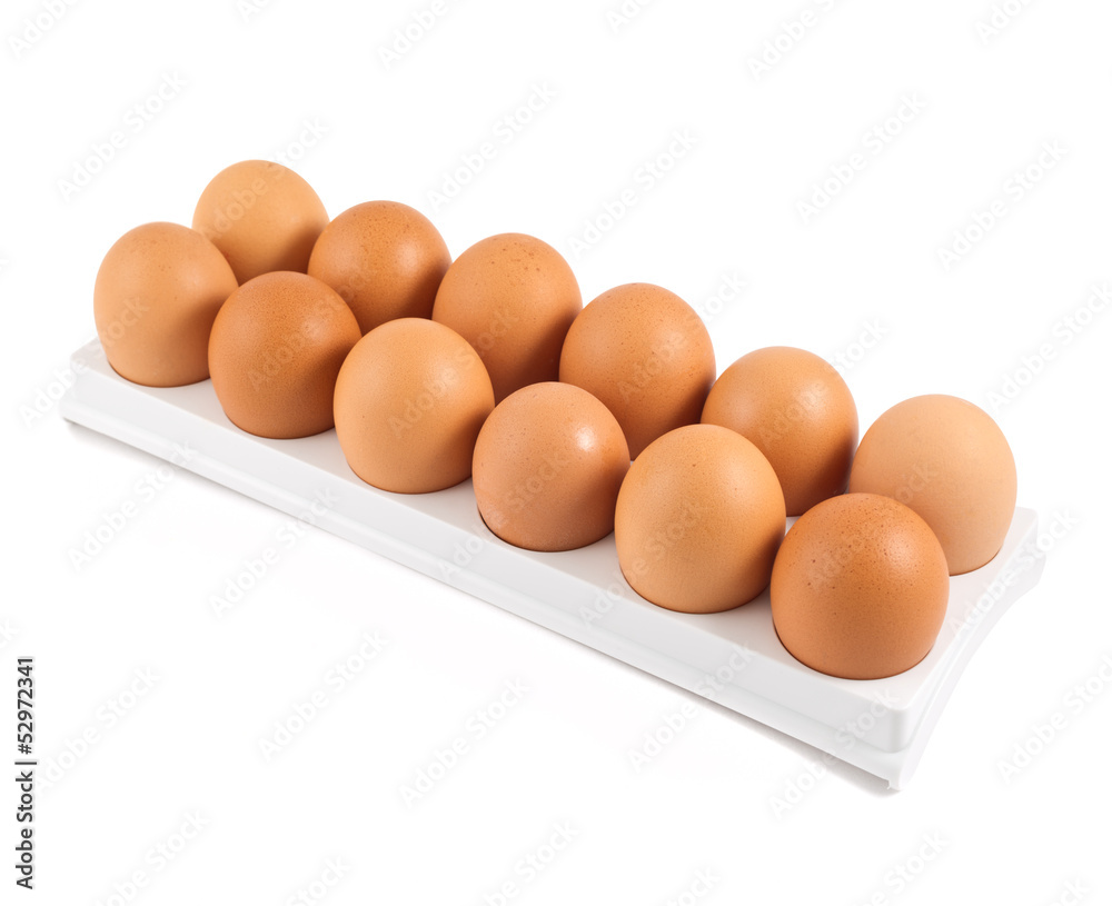 Fototapeta premium Dozen of eggs in a case isolated