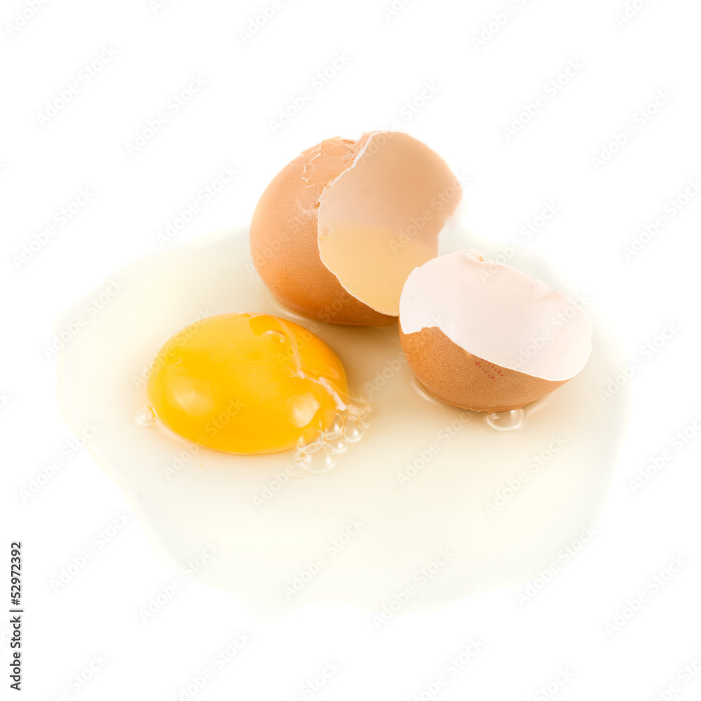 Cracked egg shell with yolk and protein Cracked egg shell with yolk and protein