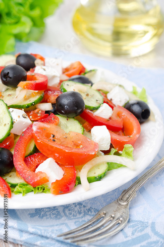 Greek salad with feta cheese, olives and vegetables, closeup
