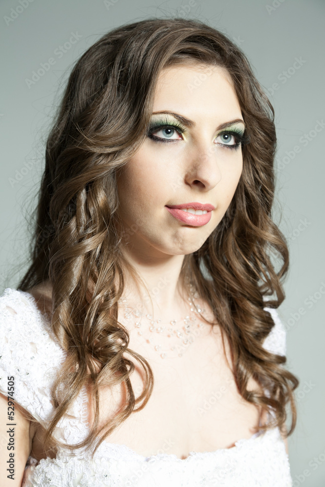 Studio portrait of young bride looking up Studio portrait of young bride looking up