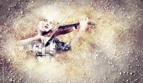 Gorgeous woman playing violin