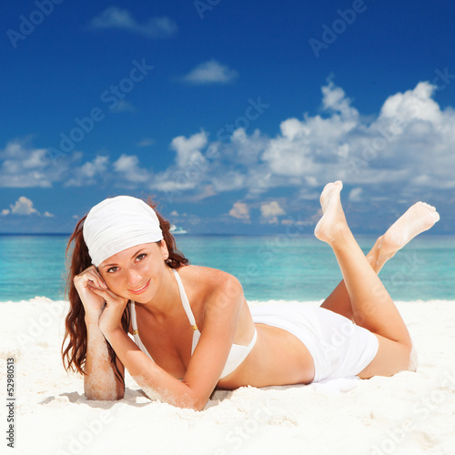 Cute woman relaxing on the beach