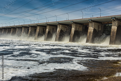 Water pouring through sleus gates at dam