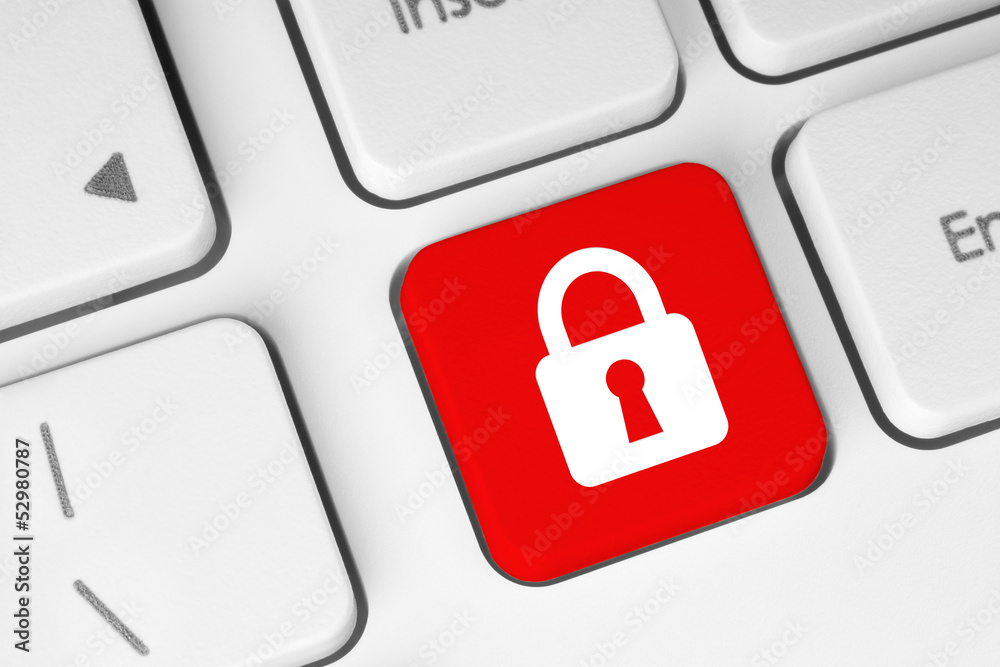 Red security button on the keyboard . Red security button on the keyboard .
